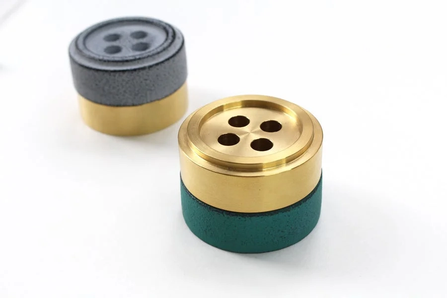 Brass and Nambu ironware paperweights stacked