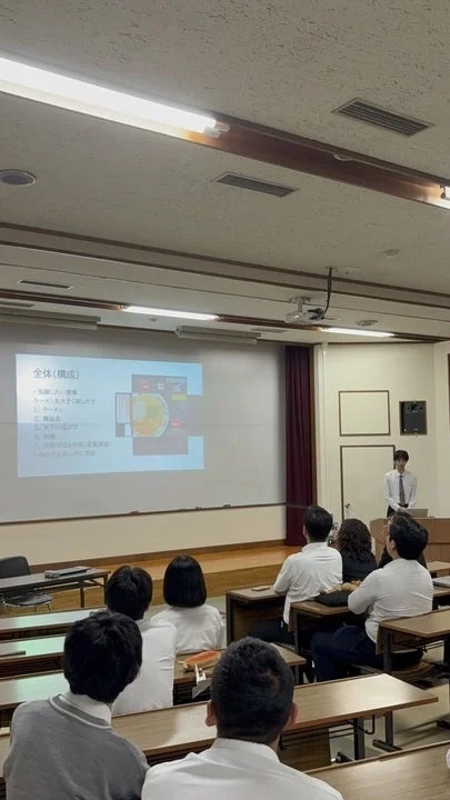 A student presenting in a classroom