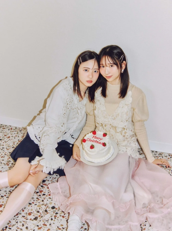 Two young women with a Christmas cake