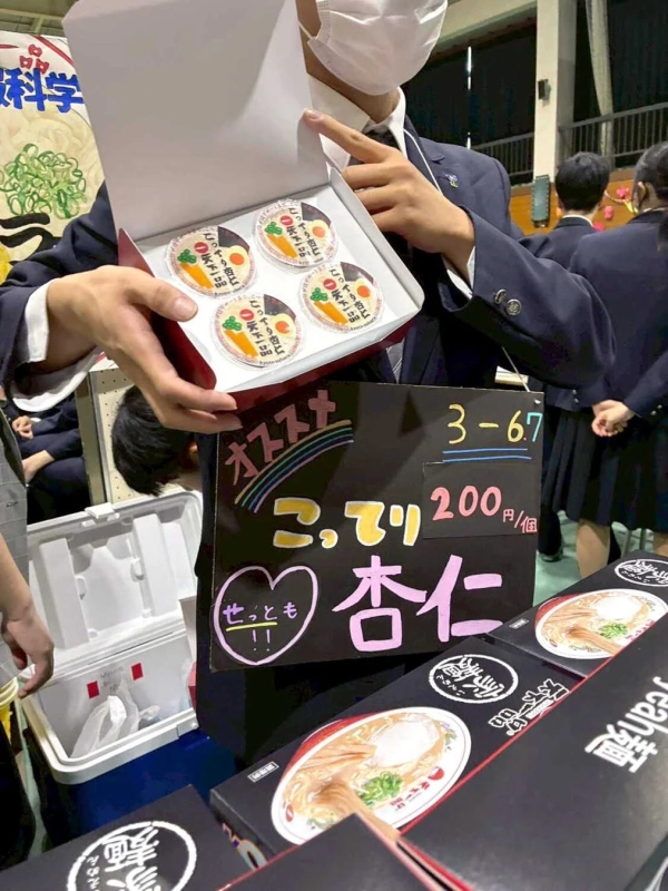 Students selling almond tofu at a school festival