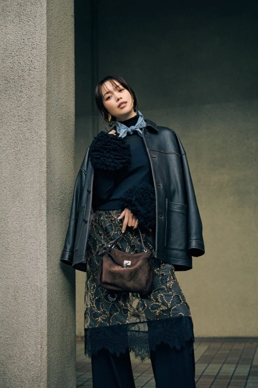 Women's fashion featuring a leather jacket and tulle skirt