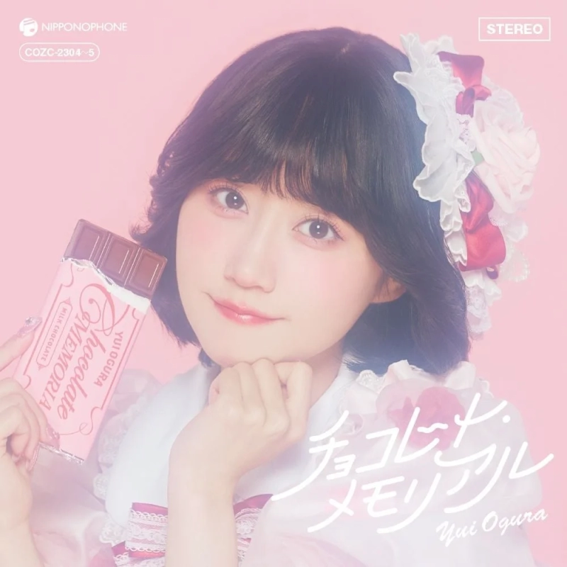 Yui Ogura holding chocolate in a frilly outfit, for "Chocolate Memorial" CD jacket