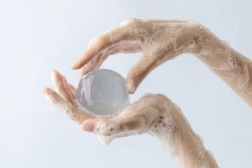 Hands with foamy jelly ball (Fresh Aqua)