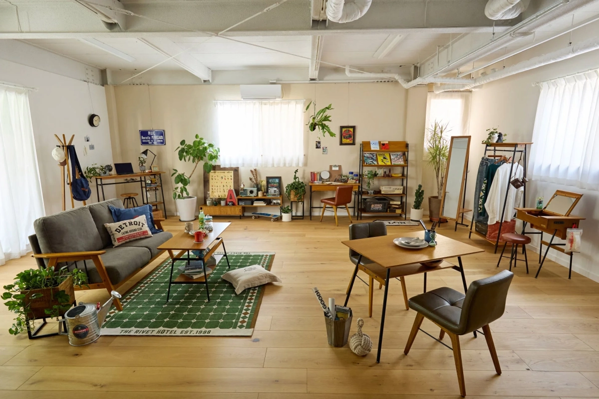 A spacious room showcasing various CHILL NEST SERIES furniture pieces, including a sofa, dining table, and desk.