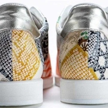 Rear view of a kimono-patterned sneaker, showcasing traditional motifs and a silver heel
