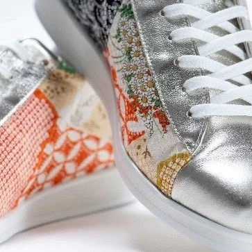 Close-up of a kimono-patterned sneaker with metallic silver accents