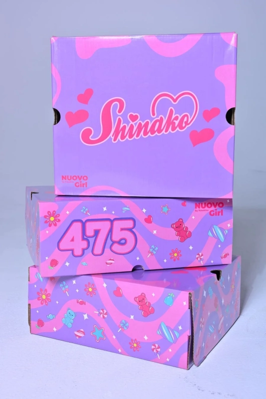 Stacked special edition shoe boxes with Shinako x NUOVOgirl branding