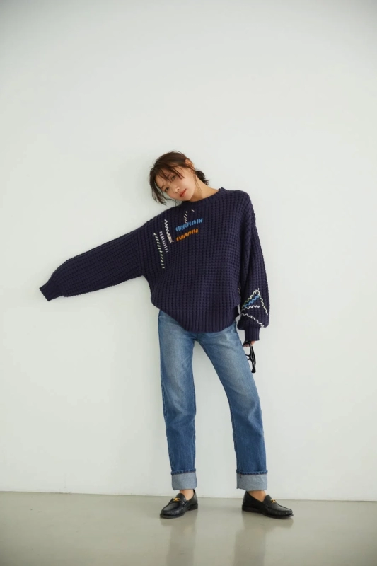 Woman in navy knit and denim