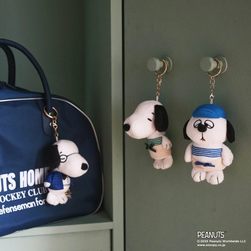 Snoopy plush keychains in various costumes