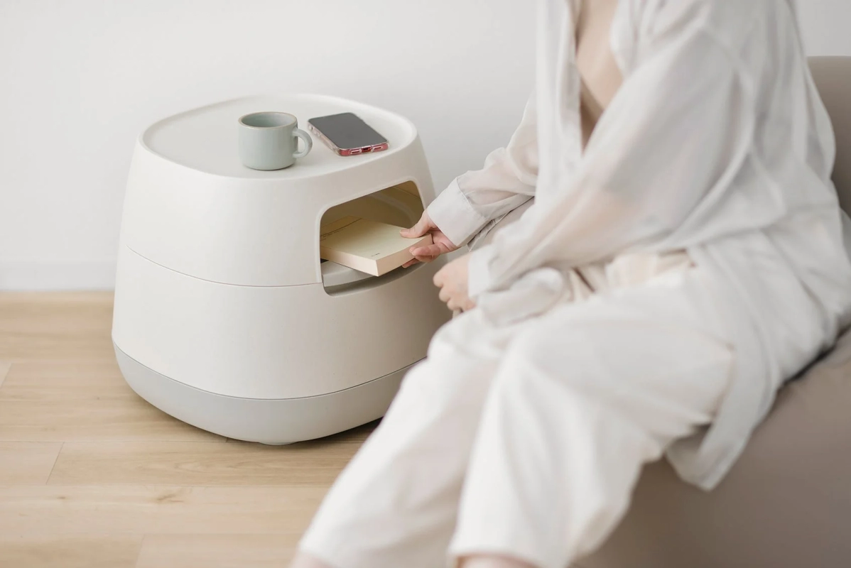Person interacting with the Moveable Cozy Storage Low Table