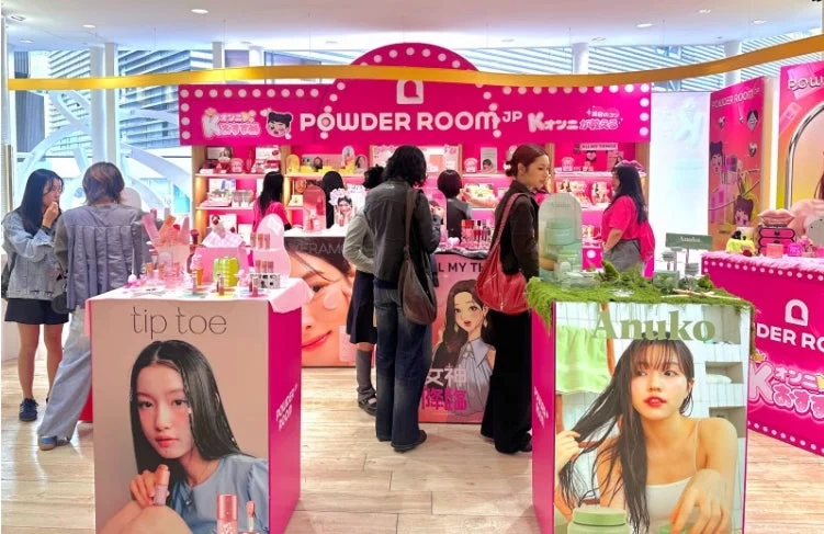 Pop-up store interior, people browsing K-Beauty products