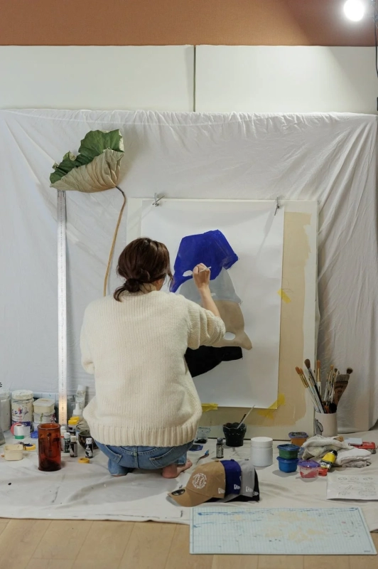 Artist painting in studio