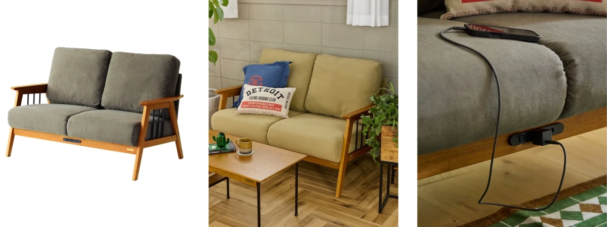 A two-seater sofa with a wooden frame and fabric cushions, featuring an integrated power outlet.