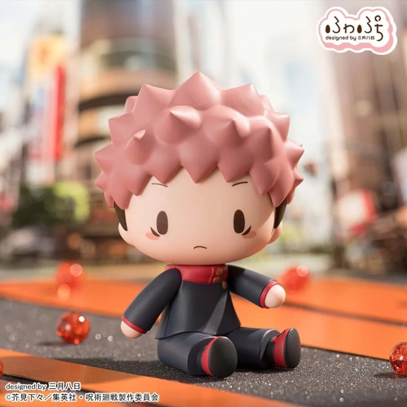 Yuji Itadori Fuwapuchi figure sitting in a cityscape setting