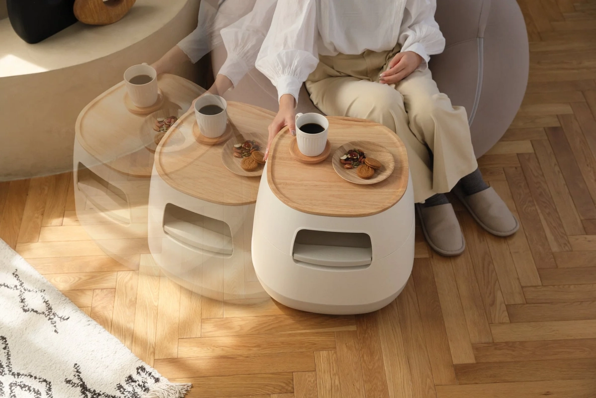 Hand reaching for the table, implying movement