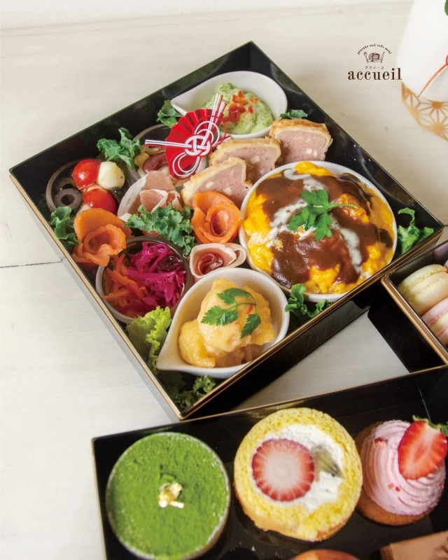 Third Tier of Accueil Oju featuring Omurice-style plate, prosciutto, and smoked salmon