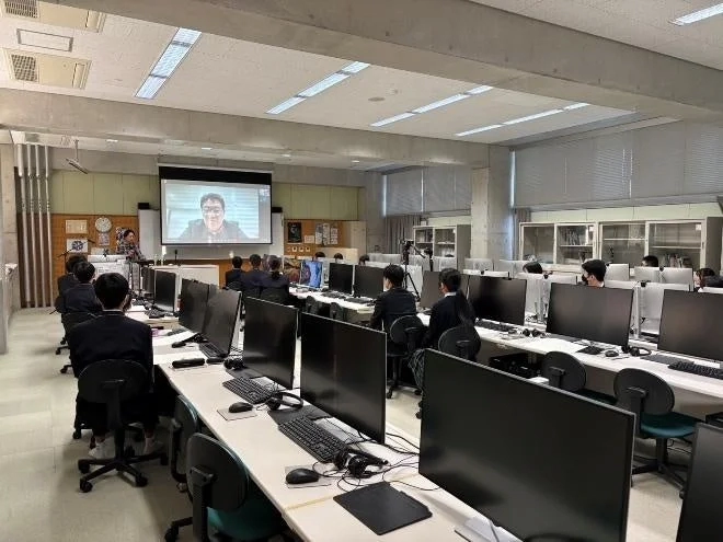 Students watching an online lecture in a classroom
