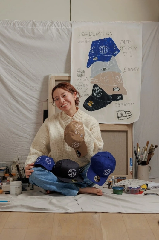 Lee Izumida with her collaboration cap