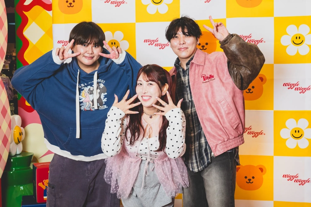 Three young people posing happily