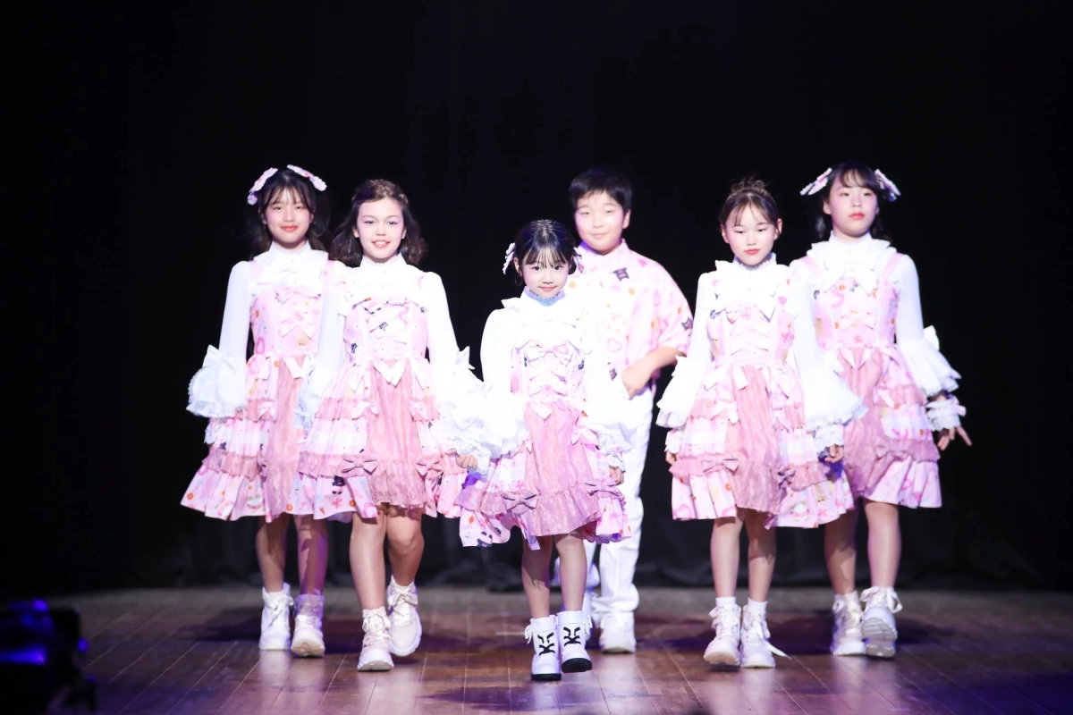 LumilU members showcasing their axes femme-designed costumes