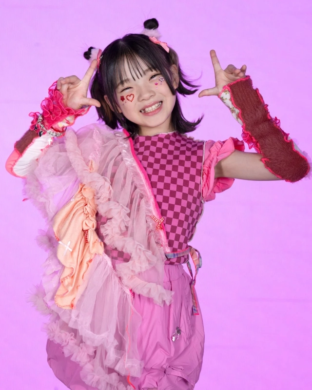 Kokoro, a girl with unique fashion, smiling brightly