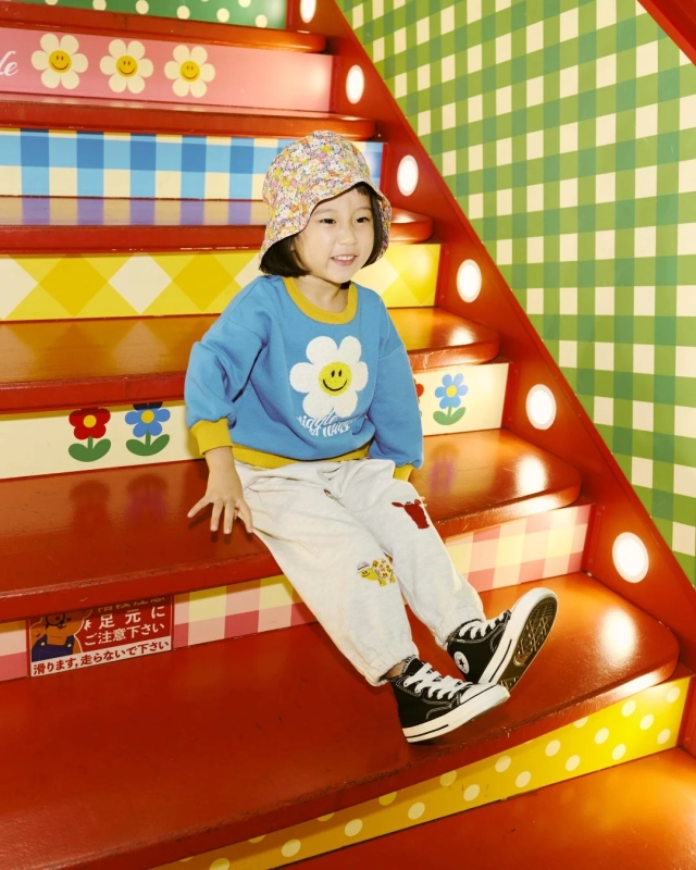 Smiling girl in Wiggle Wiggle sweatshirt