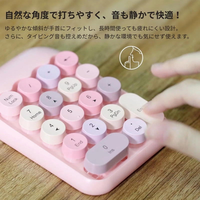 Finger typing on a pink ergonomic numeric keypad