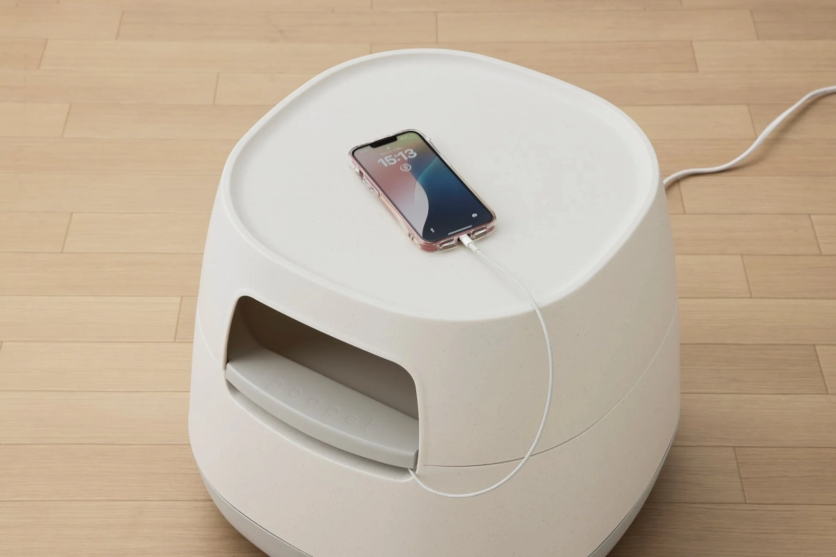 Charging phone on the table with hidden cables