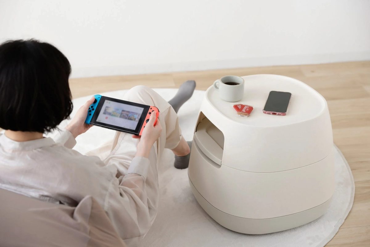 Woman gaming with the table close by