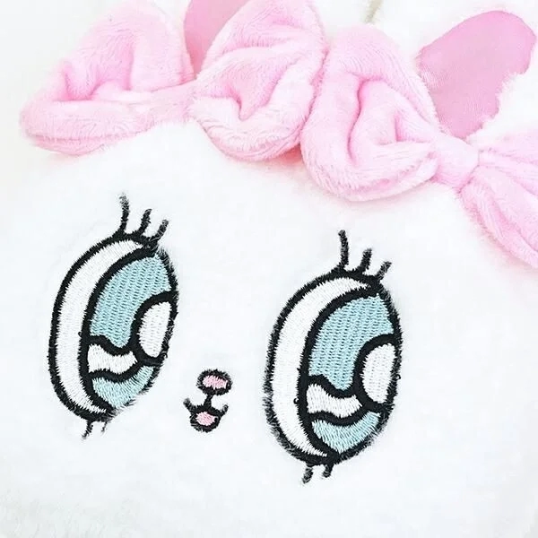 Esther Bunny's expressive blue eyes and pink ribbon