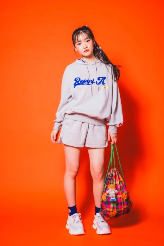 Model wearing Repipi Armario x Wiggle Wiggle collaboration hoodie and shorts