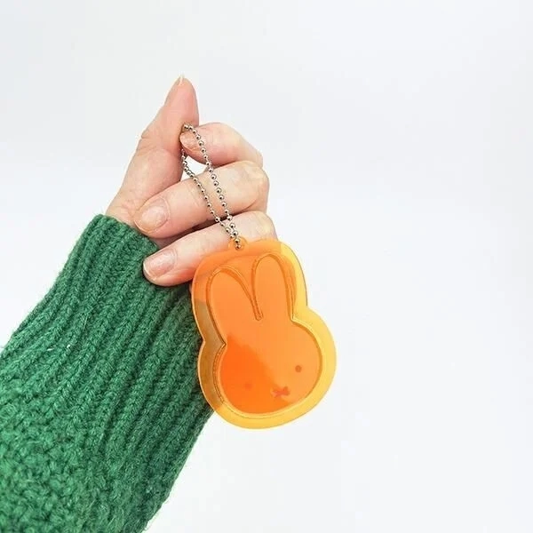 Hand holding Miffy Reflector Keychain