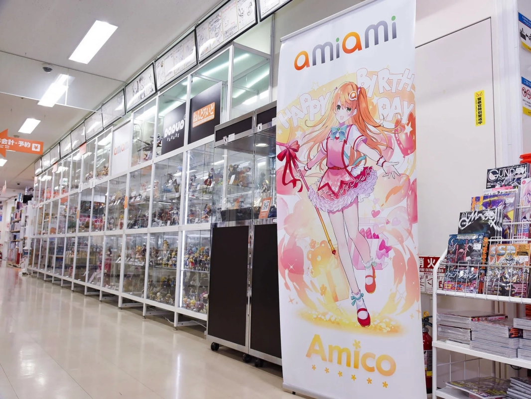 Interior of an AmiAmi hobby shop, displaying various anime figures and merchandise