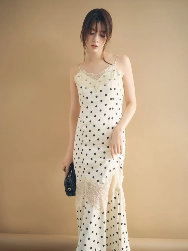 Arisa Yagi in an elegant white polka dot camisole dress with lace details