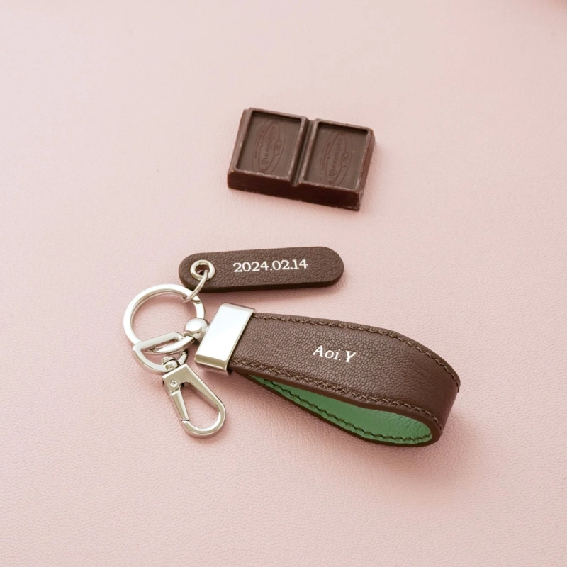 Named brown and green leather keyholders, chocolate