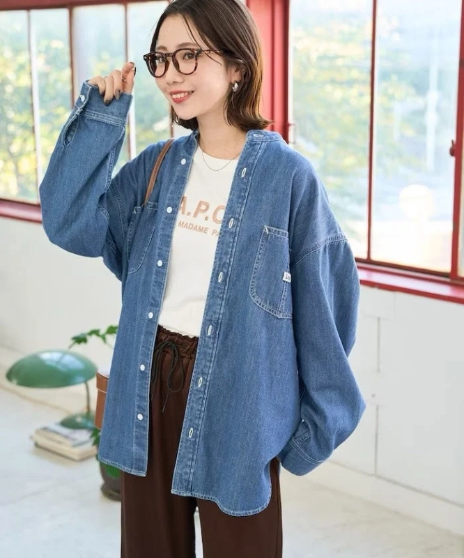 Female model in Lee oversized denim shirt