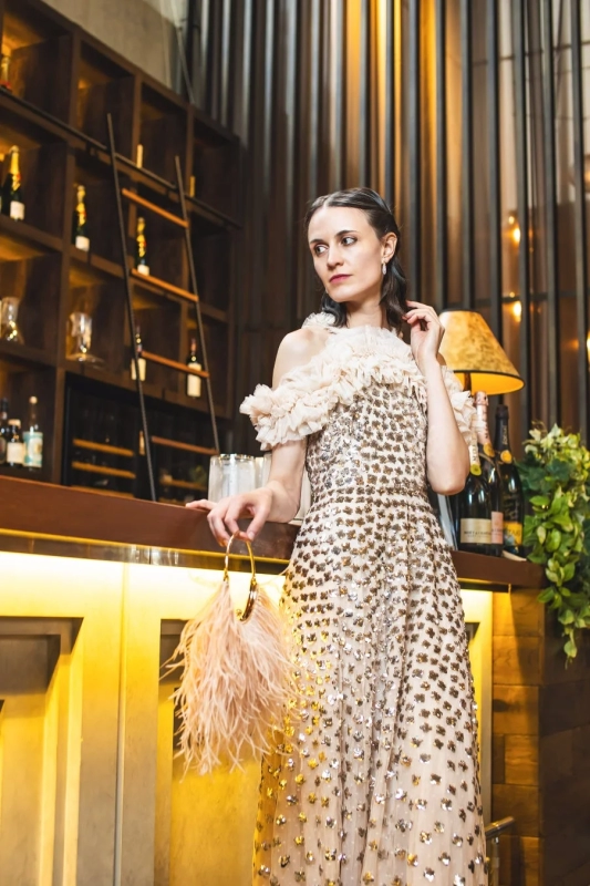 Woman in sequined off-shoulder dress