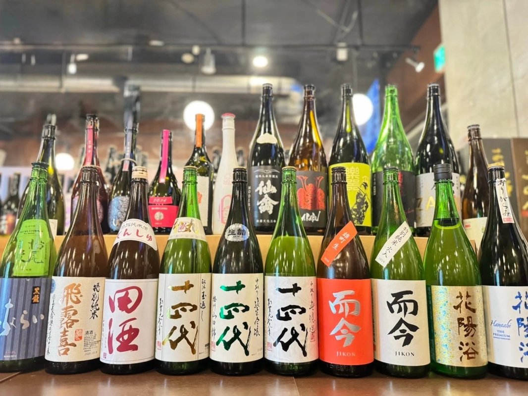 Various sake bottles in a display