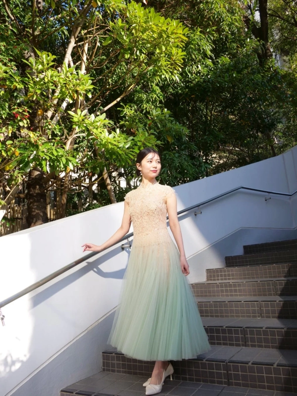 Woman in mint green tulle dress