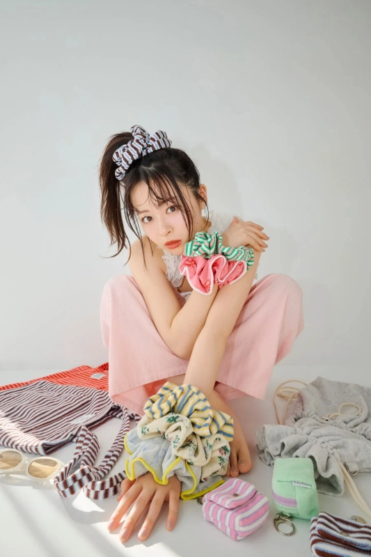 Model with colorful scrunchies and bags