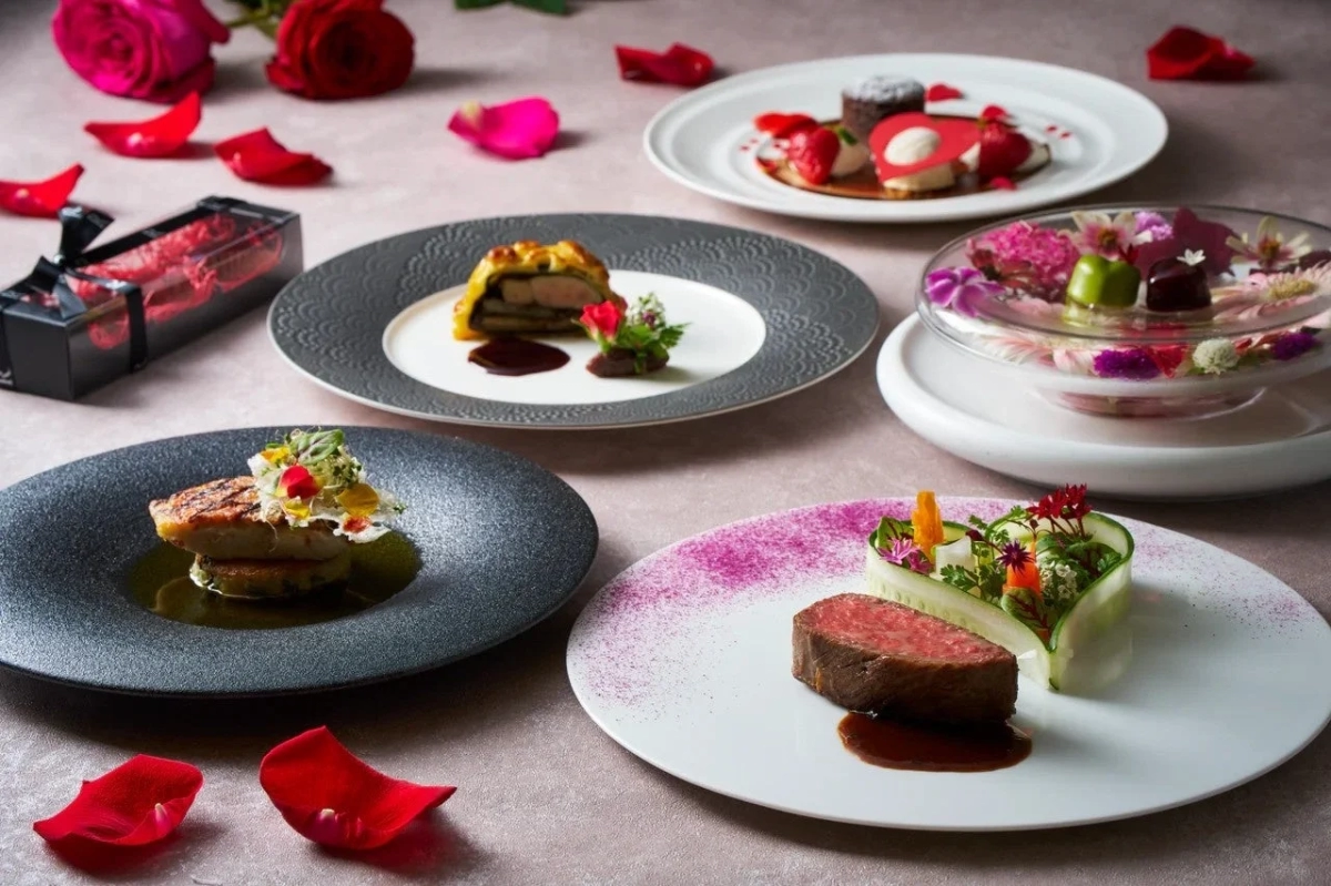 Romantic dinner table with rose petals