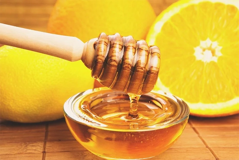 Honey dipper and lemons