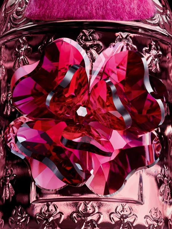 Close-up of Swarovski crystal cherry blossom on Guerlain bottle