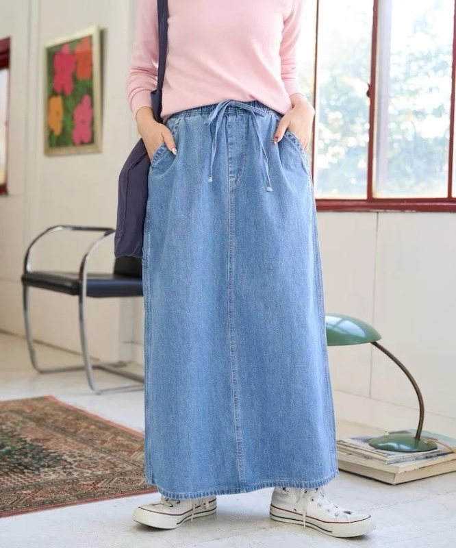 Female model in Lee denim long skirt