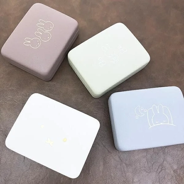 Four color variations of Miffy accessory cases