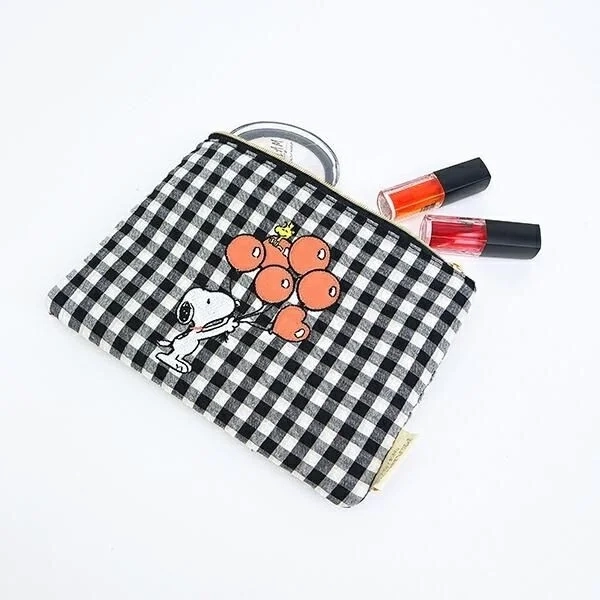 Flat pouch with cosmetics