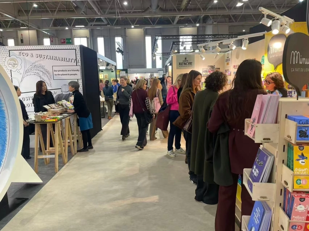 Crowded exhibition booth with 'ECO & SUSTAINABILITY' signage