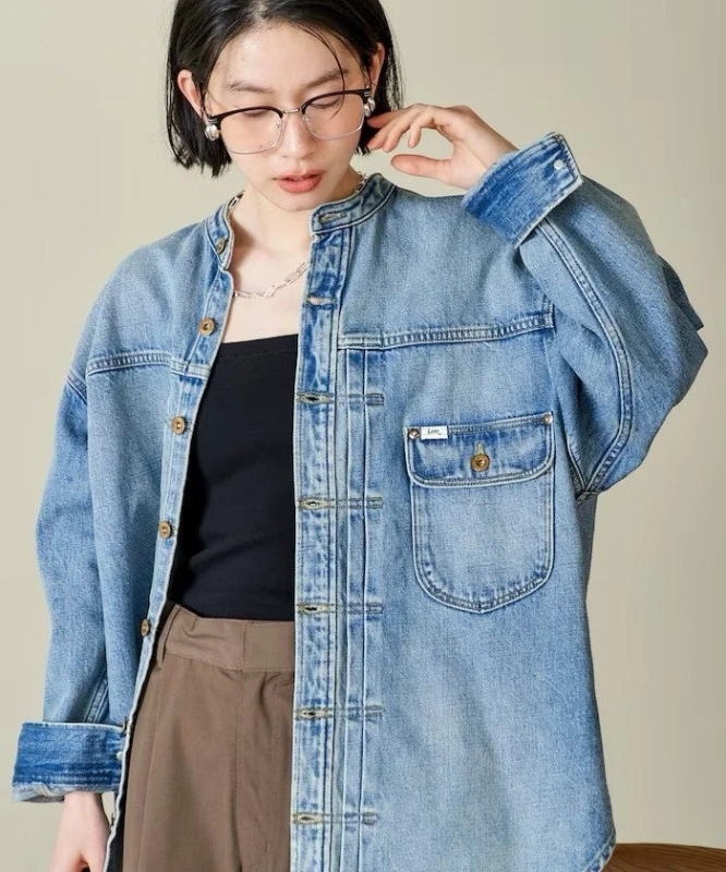 Female model in Lee collarless denim jacket