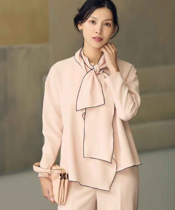 Modern collection piece: Pink bow-tie blouse and pants set