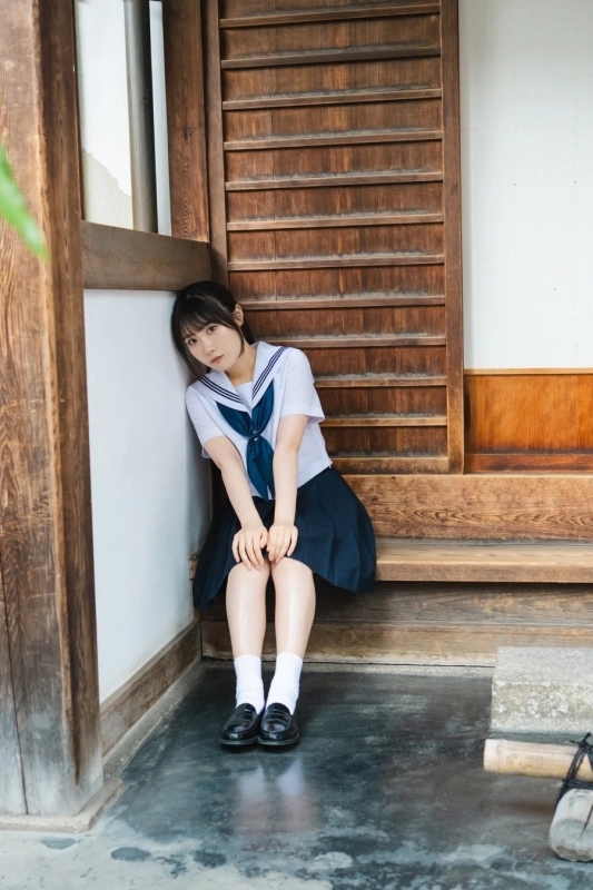 Sakura Sakakura in a school uniform at a traditional Japanese house